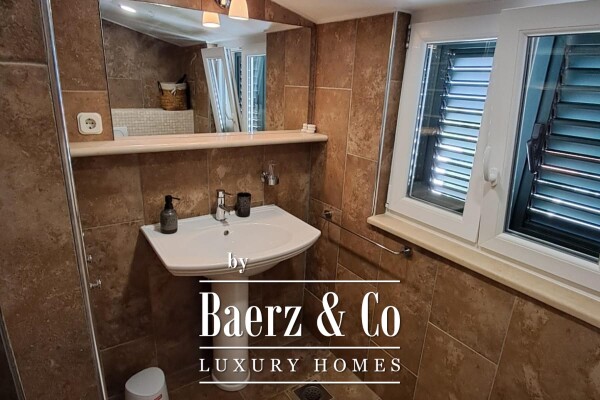 photo 15 Brač, Supetar, a house with a total area of 372 m² located on a plot of 411 m².